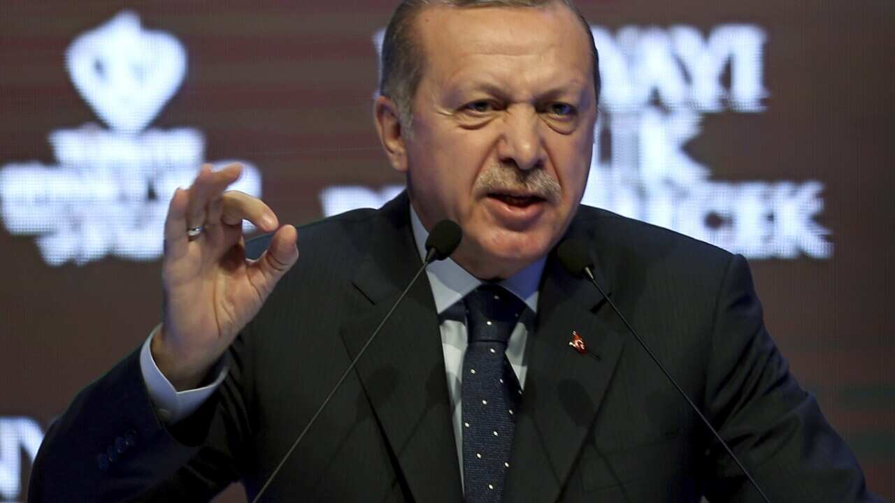 Turkey's President Recep Tayyip Erdogan talks during a rally in Istanbul, Sunday, March 12, 2017.