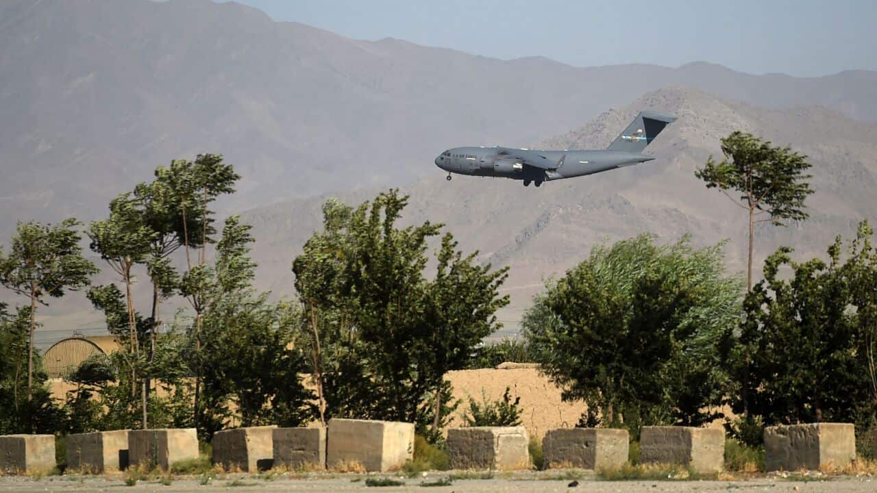A US Air Force transport plane lands at the Bagram Air Base in Bagram on 1 July, 2021.