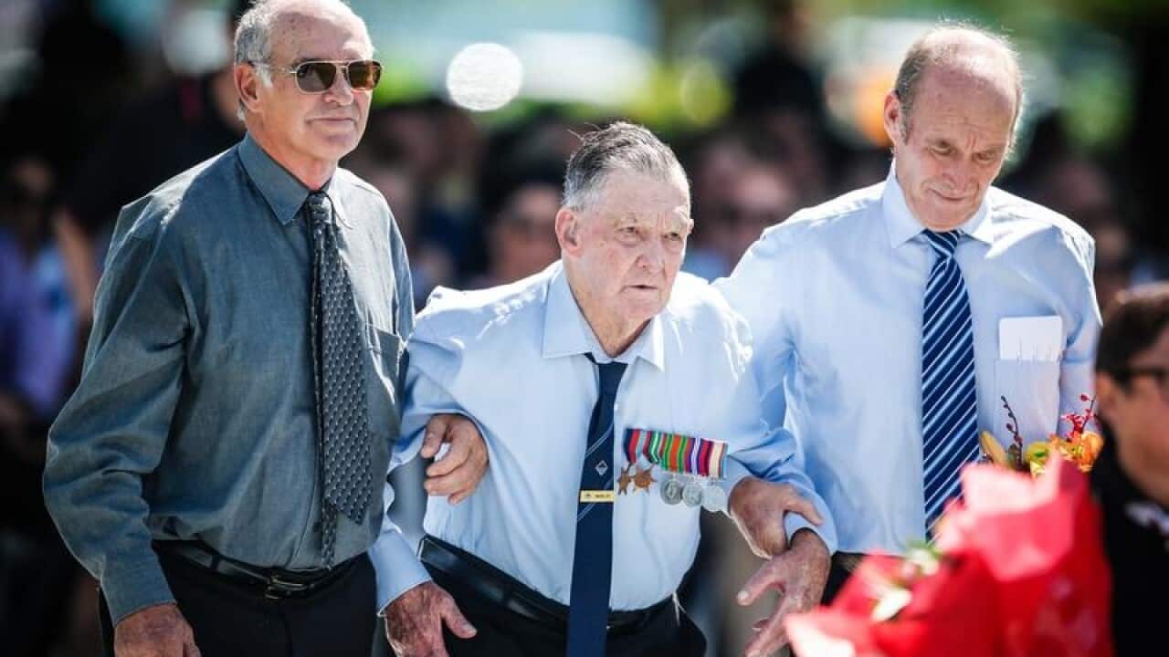 97-year-old Defense of Darwin veteran Mervyn Ey (centre)