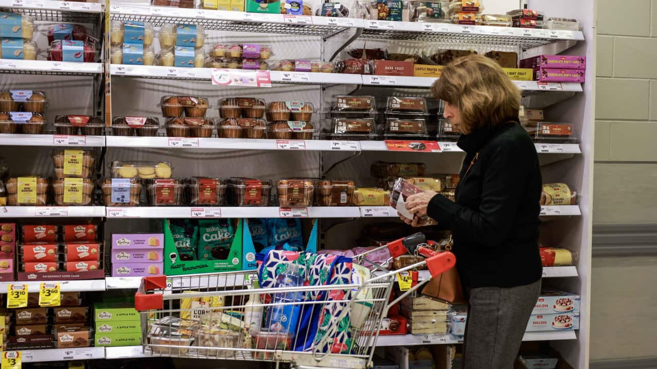 A woman shops for food at a supermarket in Canberra, Australia.