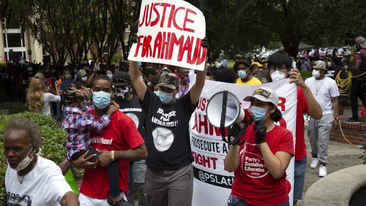 A group protest the shooting of African-American jogger Ahmaud Arbery.