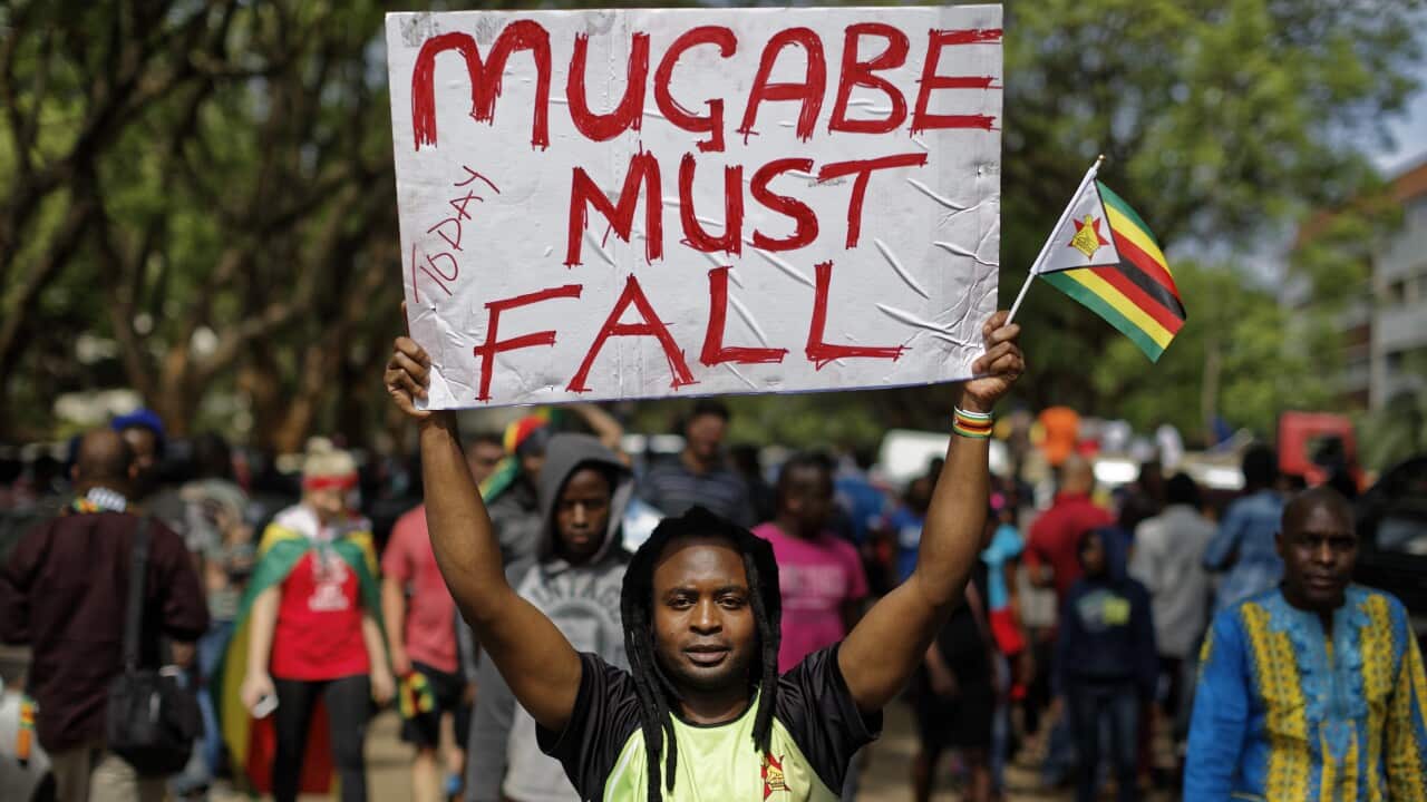 Protesters demanding Robert Mugabe stands down march towards State House in Harare.