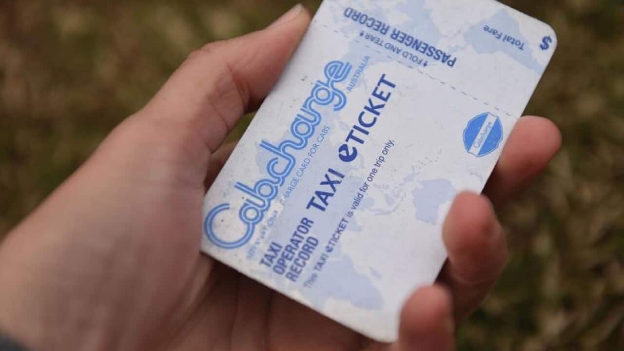 hand holding cabcharge 'creditcard'