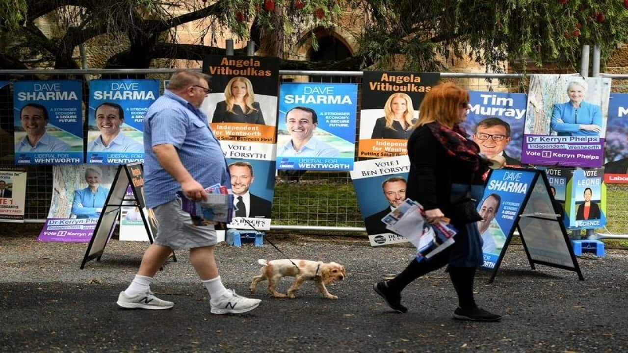 Placards seen at a pre-poll voting centre in Paddington.