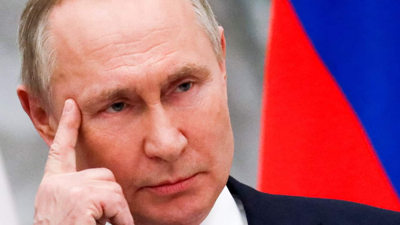 Russian President Vladimir Putin listens to a journalist's question during a joint news conference with Hungary's Prime Minister Viktor Orban