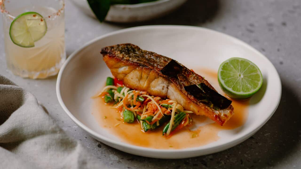 Crispy skinned barramundi with green mango som tam salad