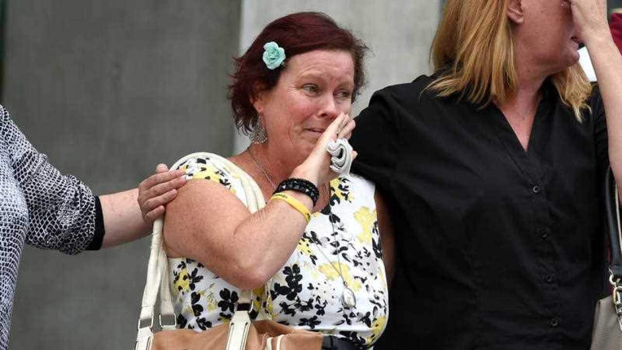 Sonya Law (centre), partner of one-punch victim Bruce Steensen, is seen leaving the Supreme Court in Brisbane.