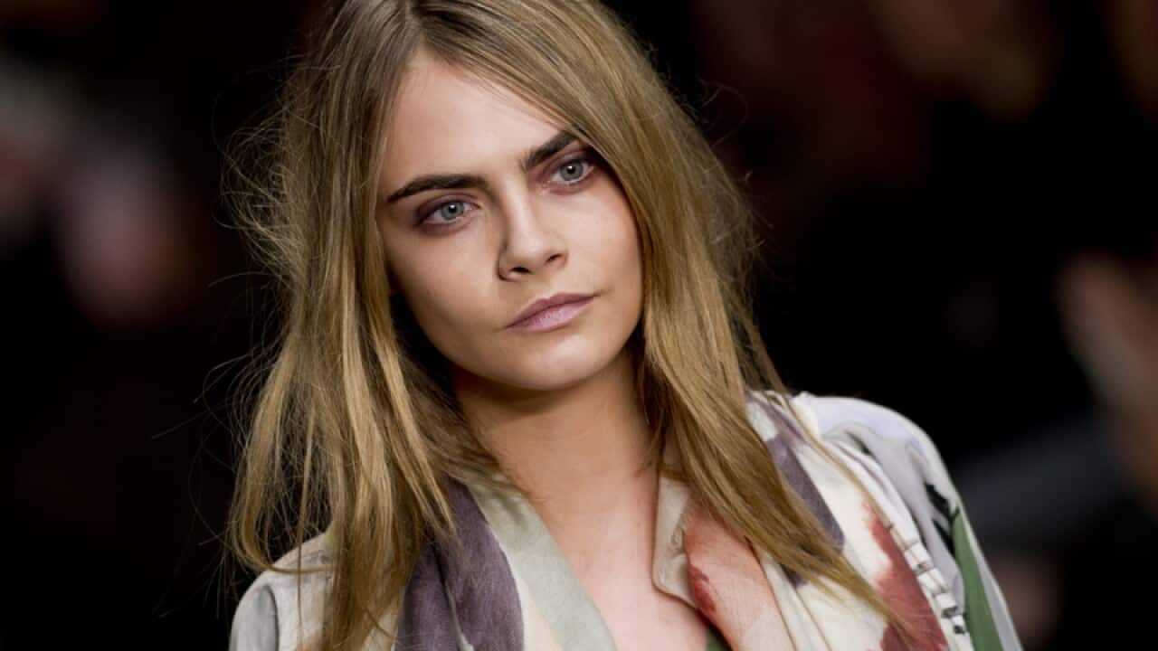 Cara Delevingne on the catwalk during the Burberry fashion show
