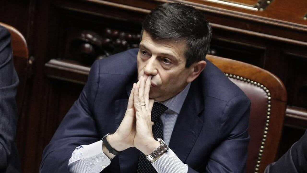 Infrastructure Minister Maurizio Lupi sits at the Lower House before announcing his resignation in Rome, Friday, March 20, 2015.