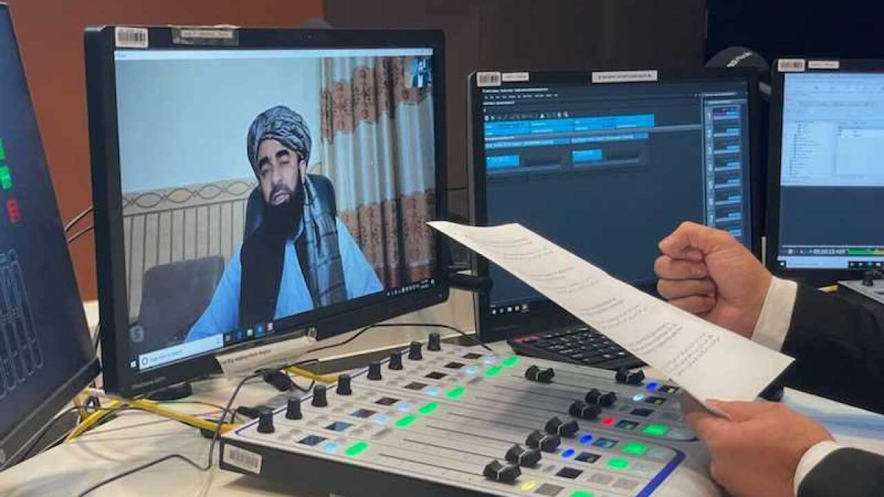 Taliban member on a television screen.