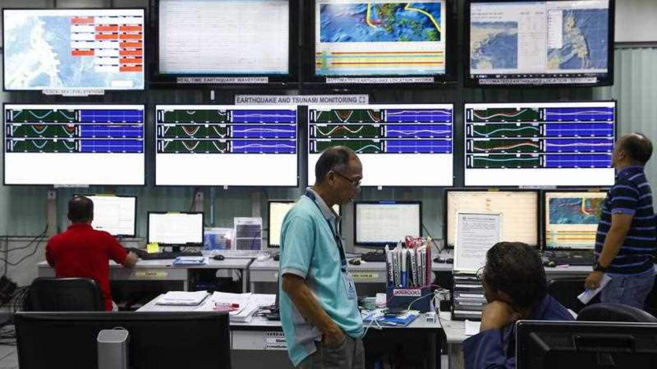 Electronic screens display data that monitor earthquakes and tsunamis at the Philippine Institute of Volcanology and Seismology (Phivolcs) in the Philippines.