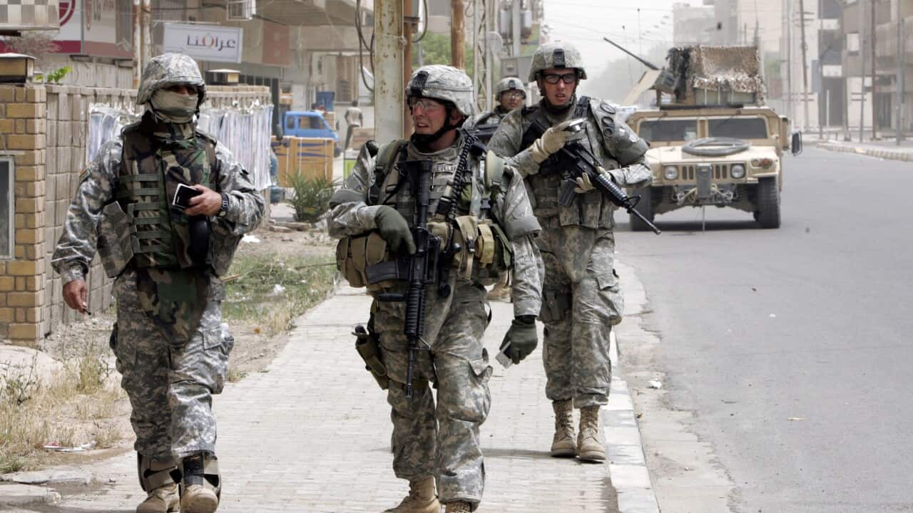 A file photograph dated on 24 April 2007 shows US troops patrolling in the streets of Baghdad, Iraq .