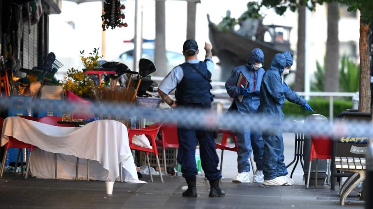 NSW Police and Forensic Services officers attend the scene of a shooting at a cafe at Bankstown City Plaza, in Bankstown, Tuesday, January 23, 2018.