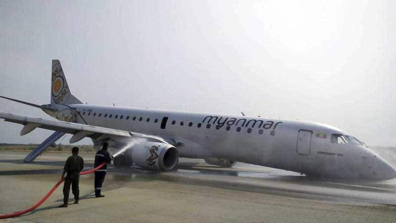 A pilot was forced to land a passenger plane without its front wheels at Mandalay international airport.