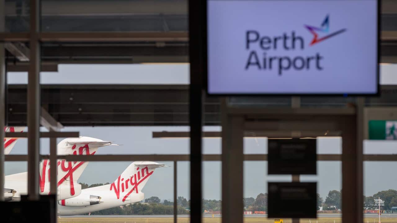 A general view of Virgin Australia aircraft at T2 Perth Domestic Airport terminal in Perth, Saturday, April 25, 2020. (AAP Image/Richard Wainwright) NO ARCHIVING