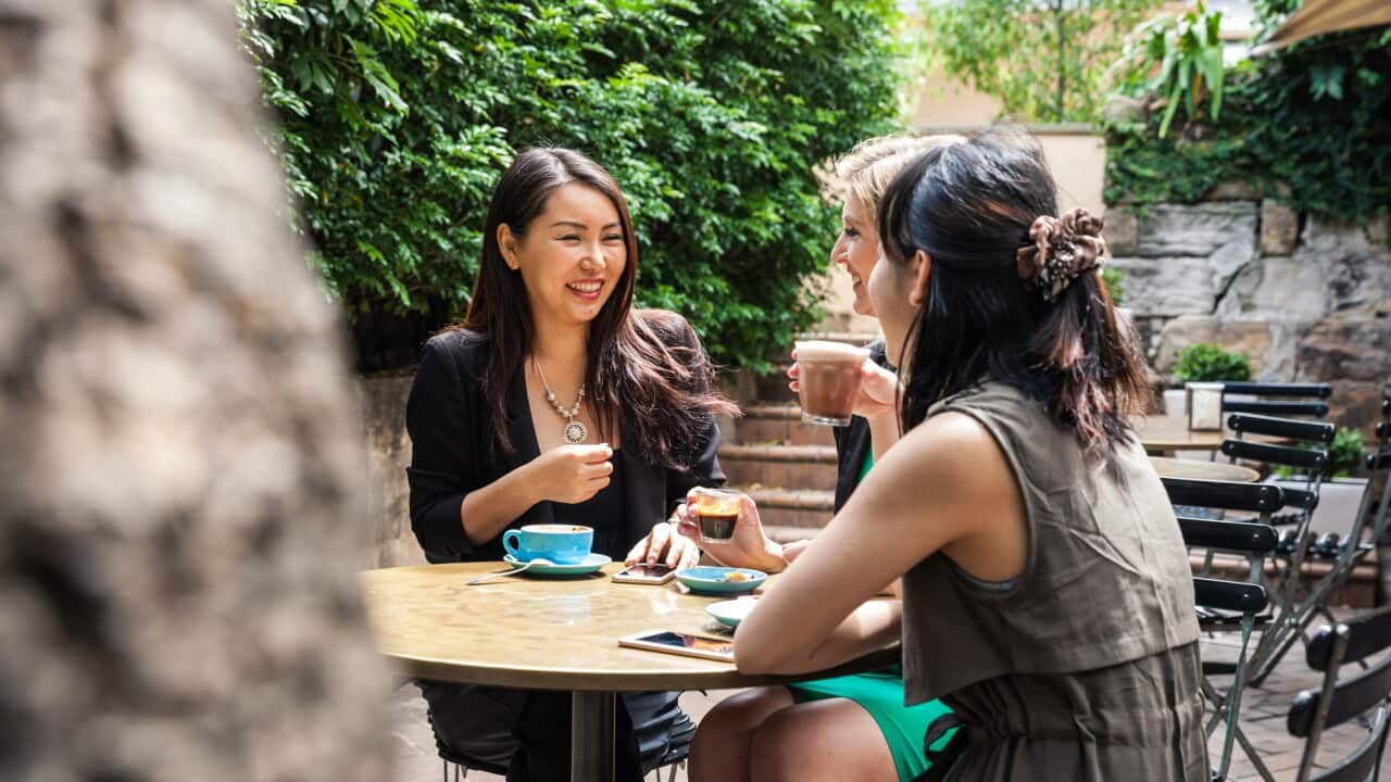 Group of multi-ethnic women drinking and chilling in a cafe in Sydney