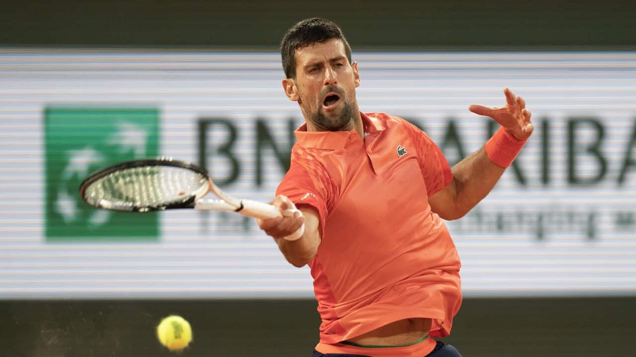 Novak Djokovic of Serbia returns a shot during his match against Marton Fucsovics at Roland-Garros