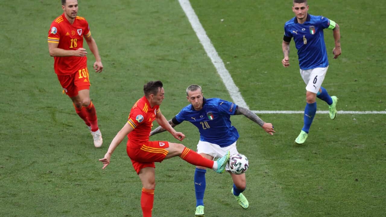 Aaron Ramsey of Wales and Marco Verratti of Italy look on as Connor Roberts of Wales anticipates Federico Bernardeschi of Italy to the ball during the UEFA Euro 2020 match at Stadio Olimpico, Rome