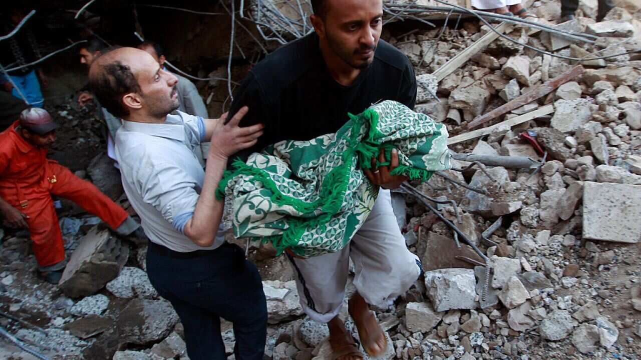 Five family members of the baby girl being carried out of the rubble were killed in a coalition airstrike that destroyed their home.