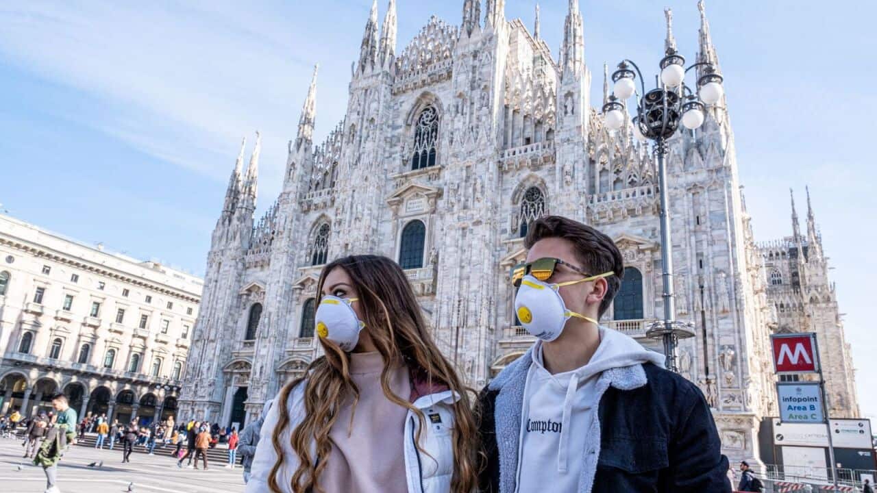 People wearing masks in Piazza Duomo, in Milan, after coronavirus outbreak in Italy, on February 24, 2020.