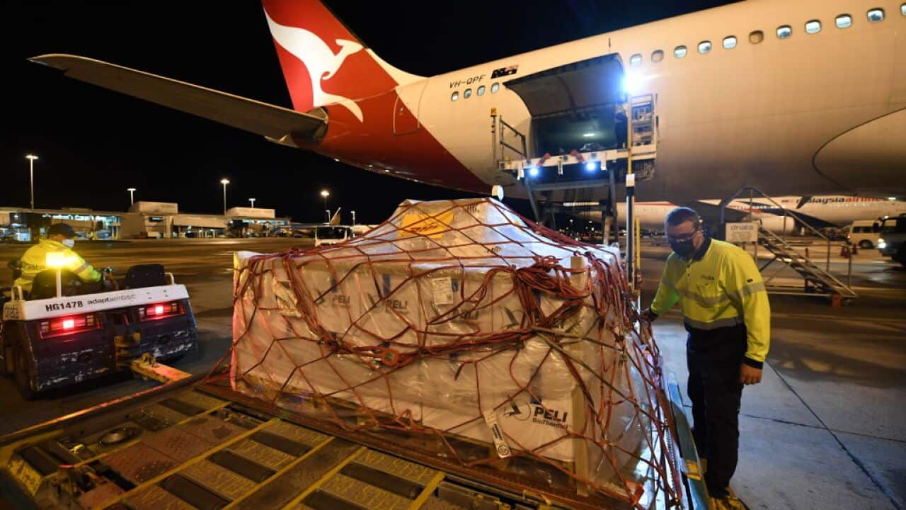 Pallets of vaccines being unloaded off Qantas flight after landing at Kingsford Smith International Airport on 5 September, 2021 in Sydney.
