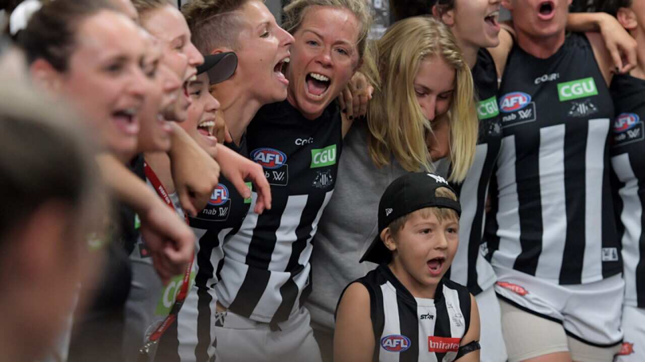 The Magpies celebrate