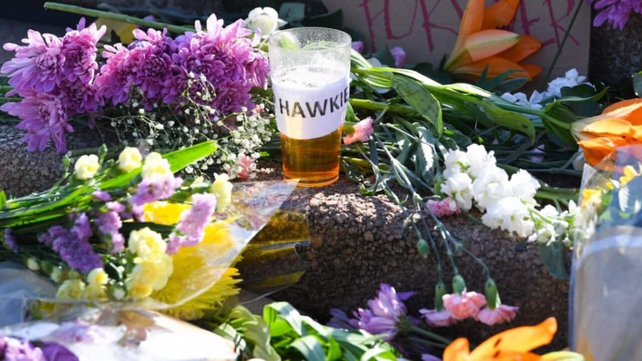Floral tributes to the late former Australian Prime Minister Bob Hawke are seen at the Opera House in Sydney.