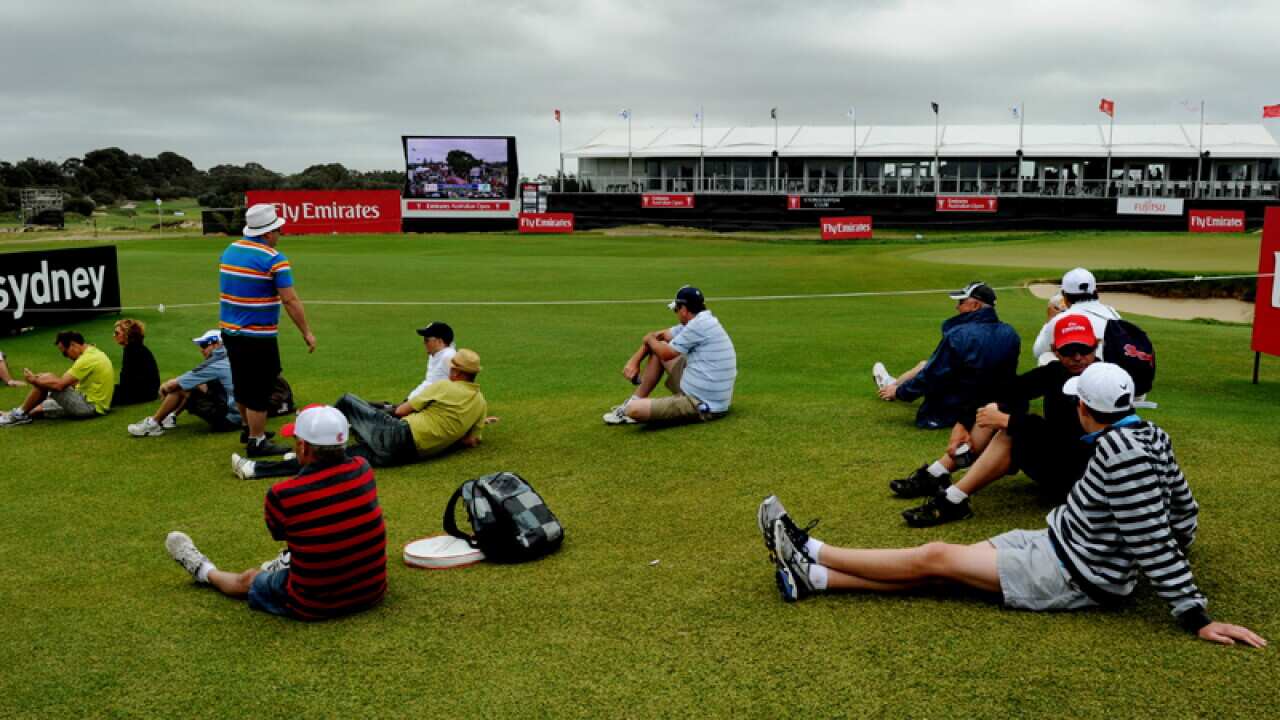 Spectators watch the Australian Open golf tournament in 2012