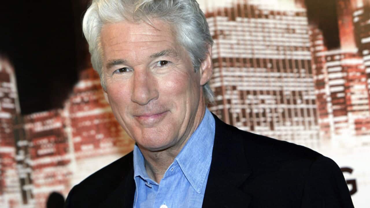 U.S actor Richard Gere poses for photographers during a photocall for his movie "Arbitrage", in Paris, Tuesday, Dec. 4, 2012. (AP Photo/ Thibault Camus)