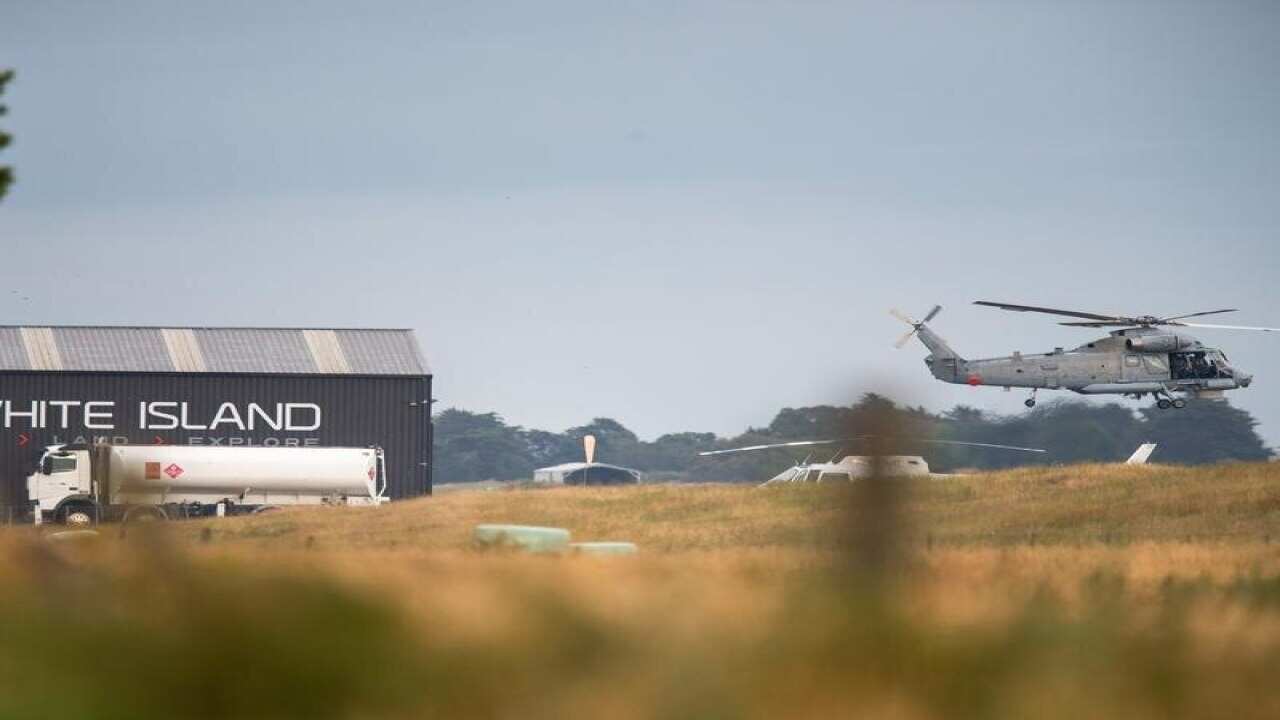 A NZ military helicopter departs for the recovery operation.