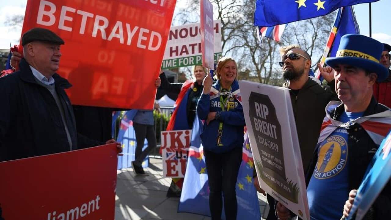 Pro EU and pro Leave demonstrators outside the Houses of Parliament