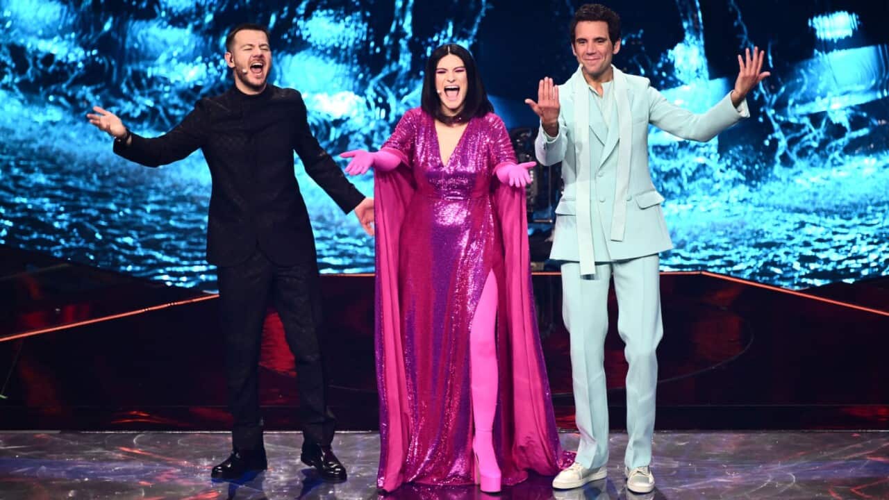 (From L) TV presenter Alessandro Cattelan, singer Laura Pausini and Lebanese-born British singer-songwriter, Mika during the first semifinal of Eurovision 2022