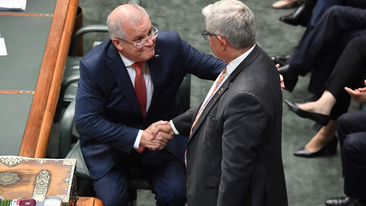 Prime Minister Scott Morrison shakes hands with Minister for Indigenous Australians Ken Wyatt