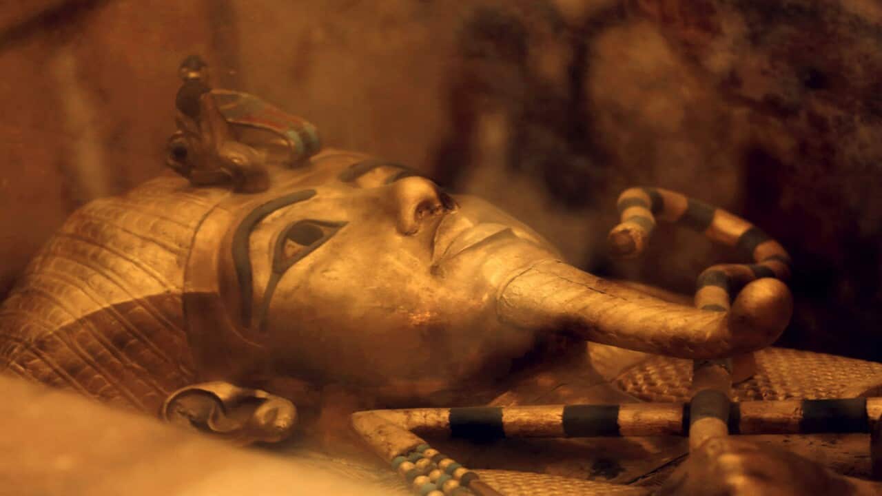 One of Egypt's famed King Tutankhamun's golden sarcophagus displayed at his tomb in a glass case.