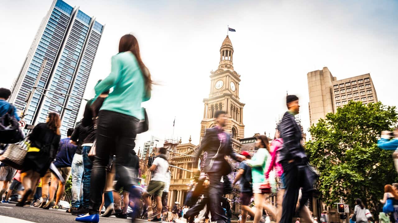 Sydney downtown, blurred intersection people and traffic