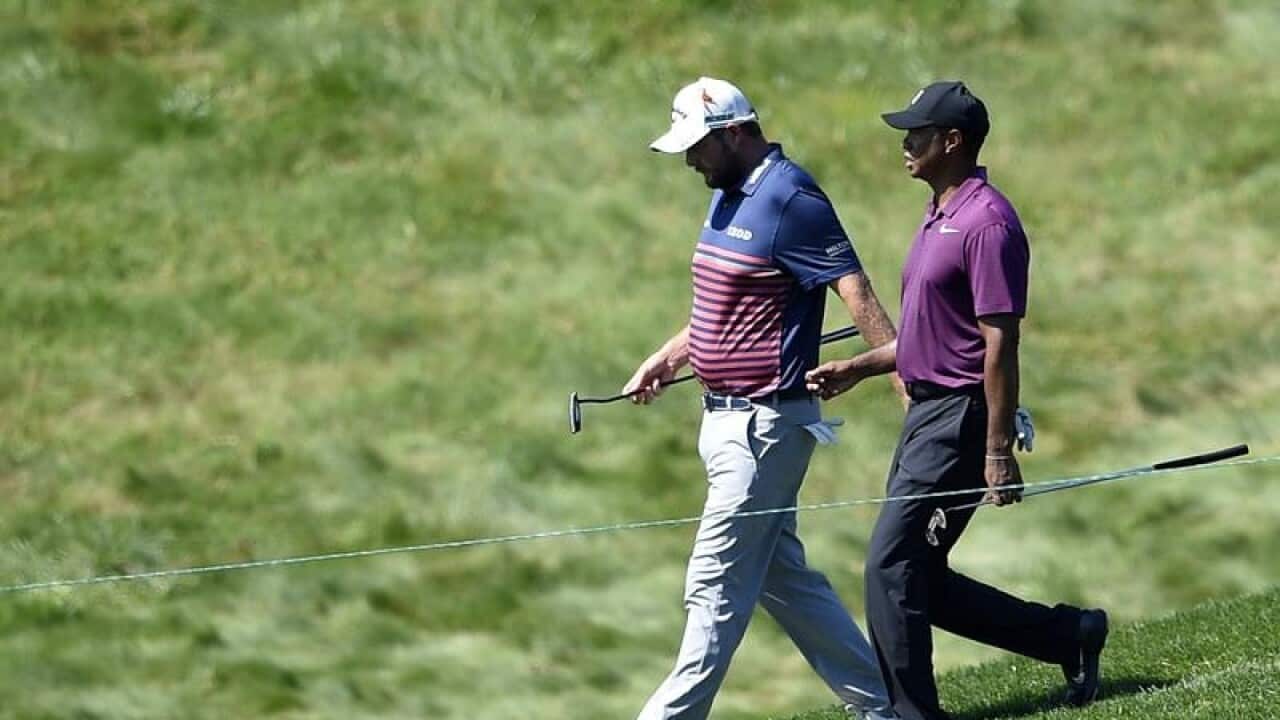 Tiger Woods and Marc Leishman
