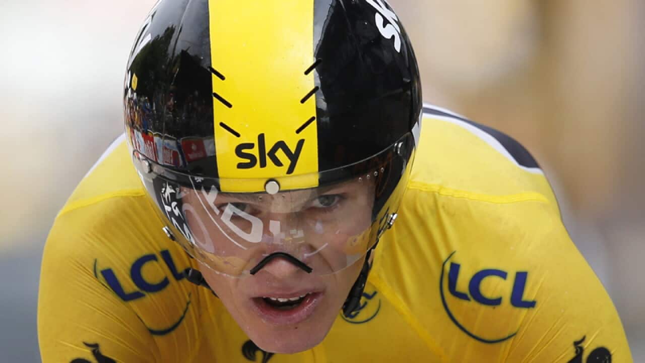 Froome wins time trial to retain Tour lead