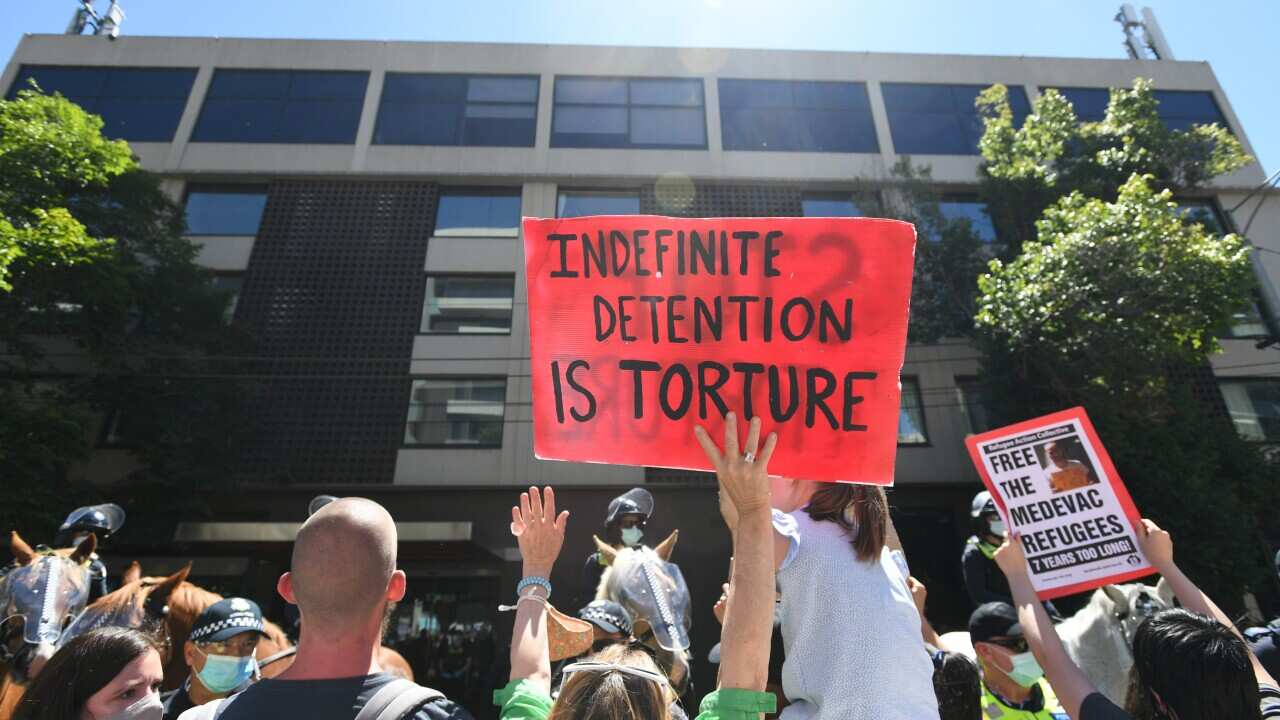 Protesters are seen outside the the Park Hotel in Melbourne, Saturday, January 09, 2021. (AAP Image/Erik Anderson) NO ARCHIVING