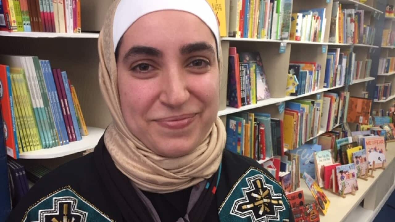 Jasmine Baker tells stories to children in English and Arabic.