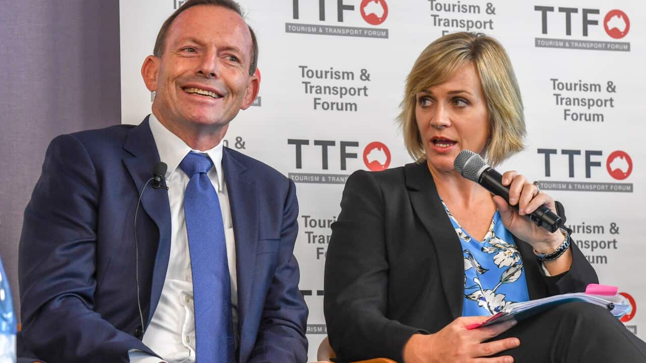 Member for the seat of Warringah Tony Abbott with Independent candidate for the Federal Seat of Warringah Zali Steggall during the Tourism & Transport Forum?s 2019 Leadership Summit in Sydney, March 8, 2019. (AAP Image/Peter Rae) NO ARCHIVING