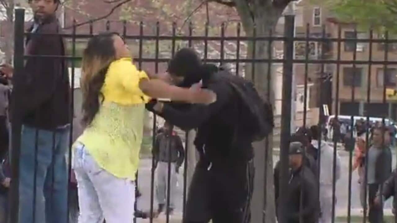 A video of a mother slapping her teenage son for rioting in Baltimore has gone viral, with the woman heralded as 'Mom of the Year'. (Screenshot)