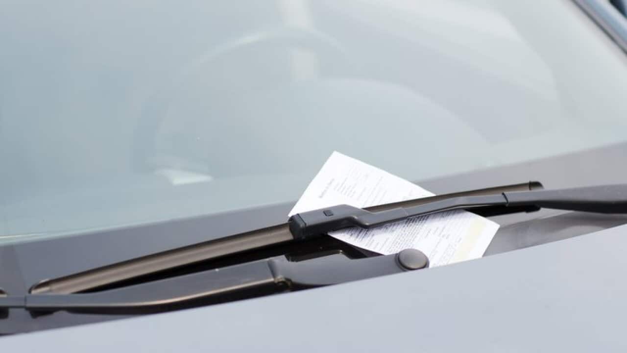 parking ticket on car windscreen