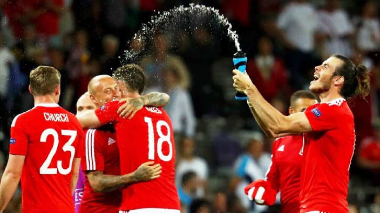 Wales captain Gareth Bale and teammates celebrate victory over Russia in their Euro Group B match. Photograph: Michael Dalder