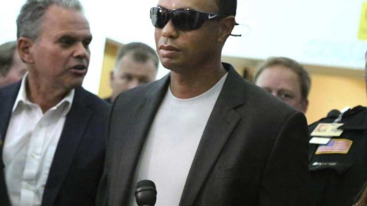 Tiger Woods leaves court in Florida