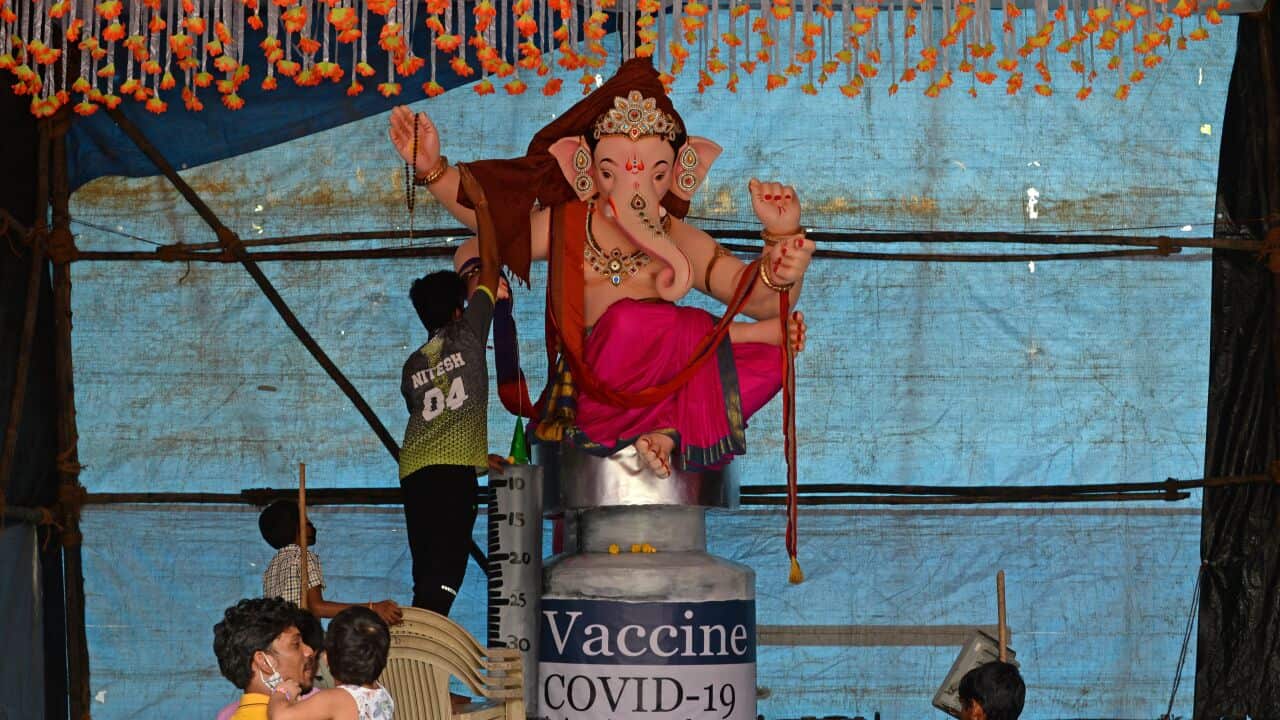 Devotees prepare for the Ganesh Chaturthi festival in Mumbai.
