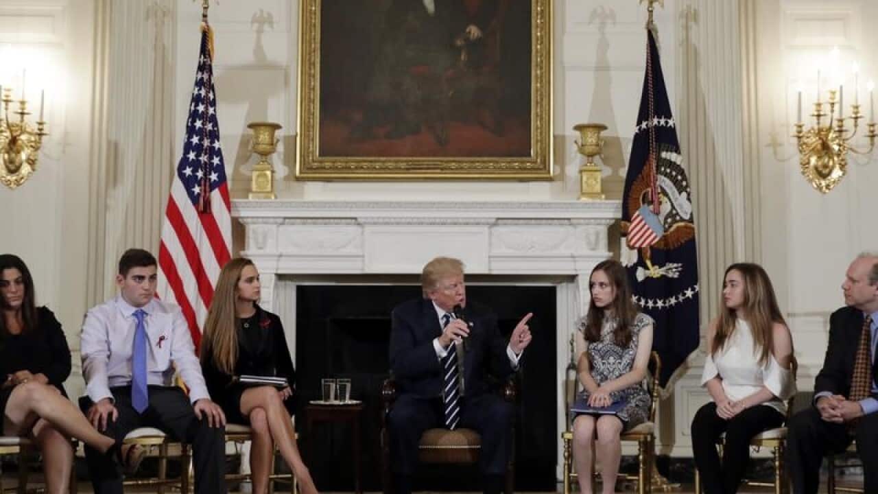 US President Donald Trump speaks to students in the White House.
