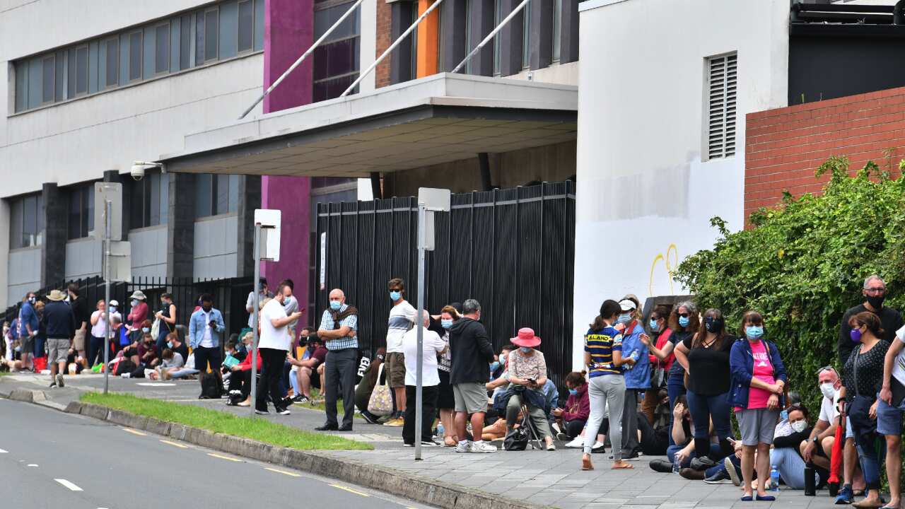 Long lines of people queue for COVID-19 testing at the Wollongong District Hospital.
