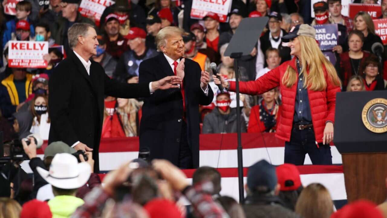 President Donald Trump attends a rally in support of Senators David Perdue and Kelly Loeffler on 5 December in Valdosta, Georgia.