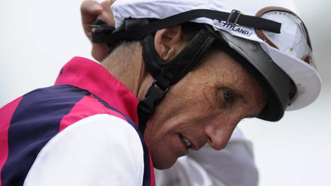 Jockey Damien Oliver has been charged over a $10,000 bet he placed on a rival horse in 2010.