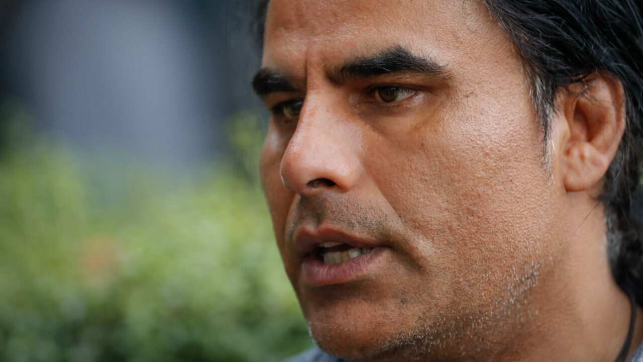 Abdul Aziz, survivor of mosque shooting speaks to Associated Press during an interview in Christchurch, New Zealand, Saturday, March 16, 2019.